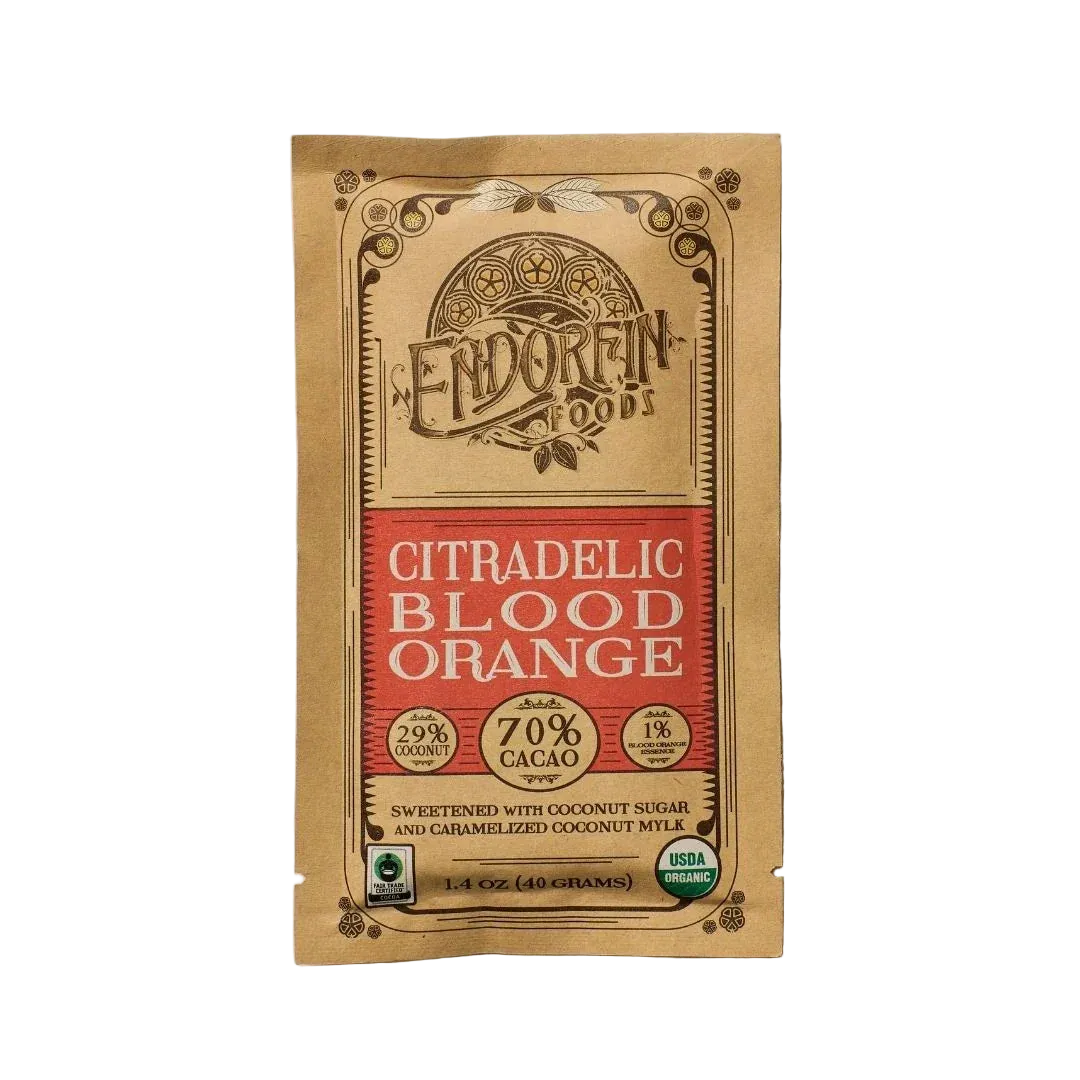 Citradelic Dark Chocolate Bar | 70% Cacao, front of package on cream surface