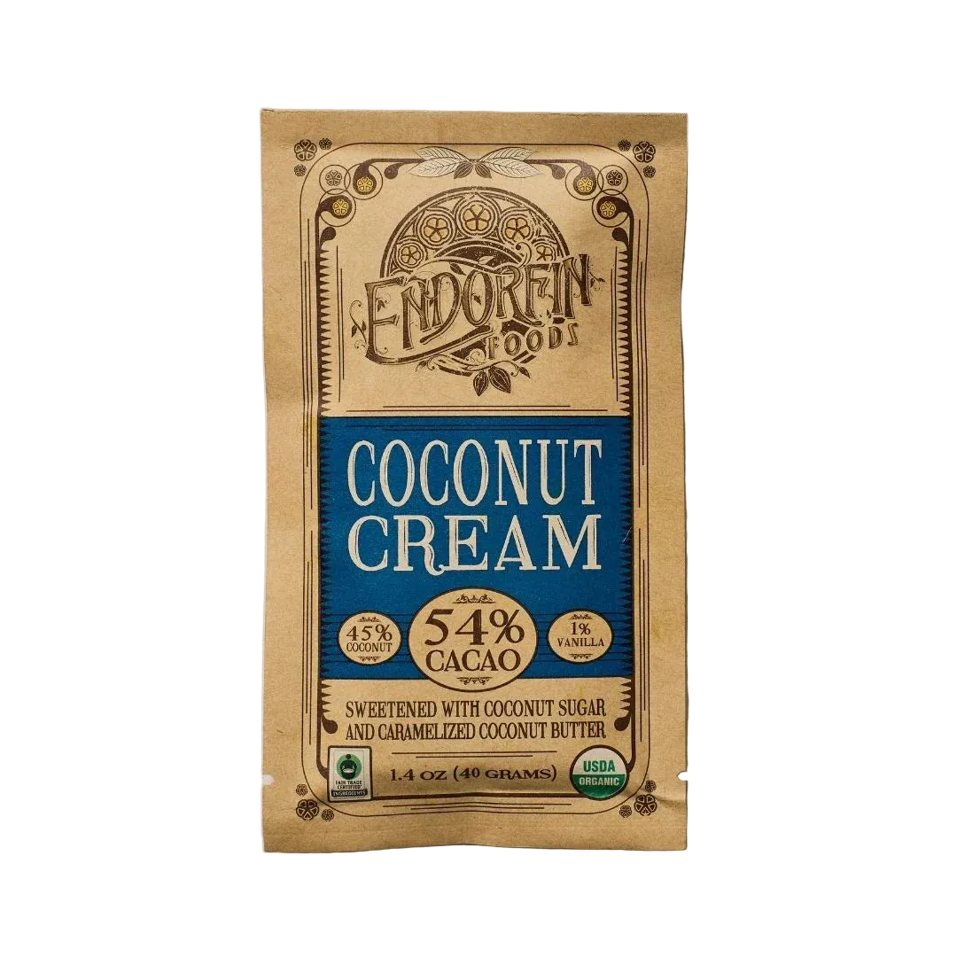 Vegan Milk Chocolate Bar, Coconut Cream, 54% Cacao, front of package on cream surface