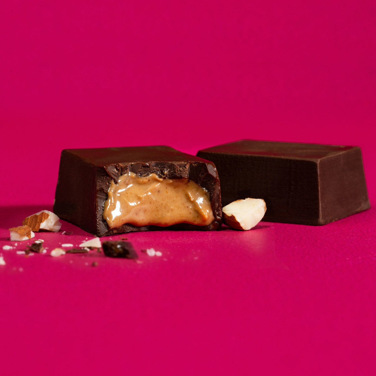 Almond Butter Chocolate Bar, styled lifestyle view on cream surface, vegan