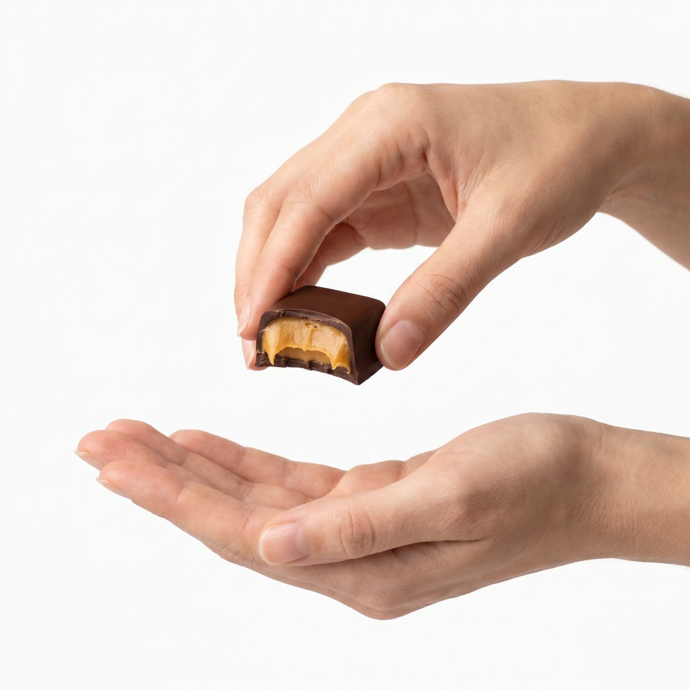 Coracao chocolate held in hands, protein and cacao ritual close-up