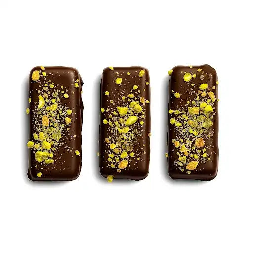 Three dubai chocolate bars with yellow toppings on a white background