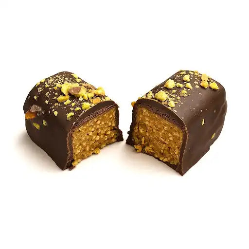 Dubai chocolate-covered treat with a crumbly texture on a white background